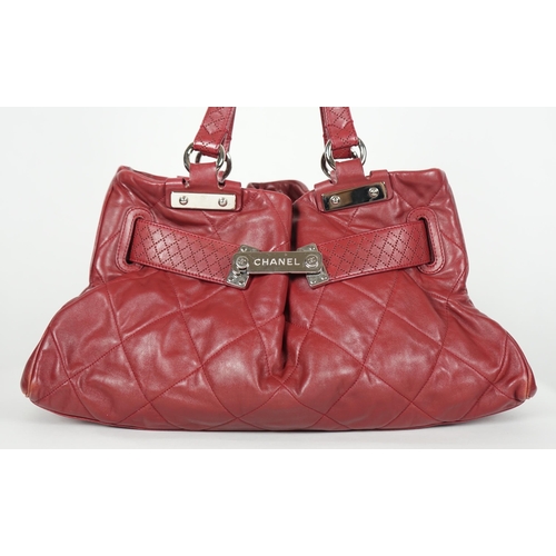 1130 - ** ** A Chanel burgundy leather buckled handle bag, with dust bag, Authentication no: 12244695 (with... 