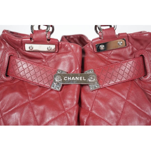 1130 - ** ** A Chanel burgundy leather buckled handle bag, with dust bag, Authentication no: 12244695 (with... 