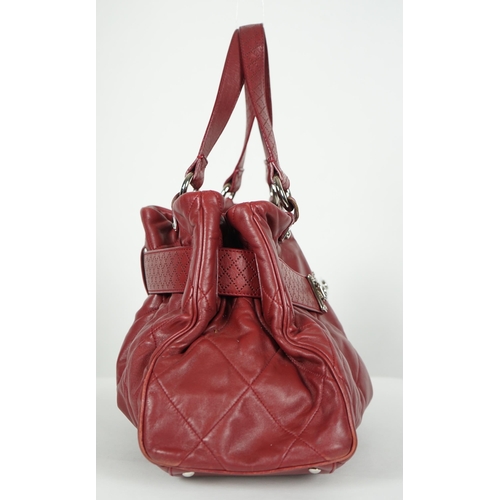 1130 - ** ** A Chanel burgundy leather buckled handle bag, with dust bag, Authentication no: 12244695 (with... 