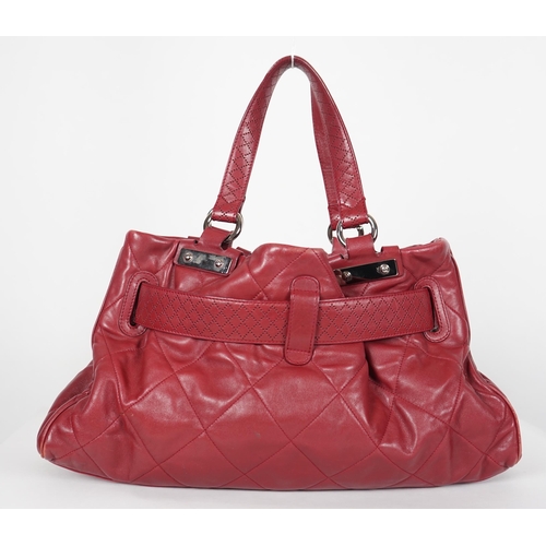 1130 - ** ** A Chanel burgundy leather buckled handle bag, with dust bag, Authentication no: 12244695 (with... 