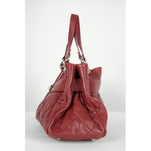 1130 - ** ** A Chanel burgundy leather buckled handle bag, with dust bag, Authentication no: 12244695 (with... 