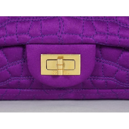 1137 - A Chanel medium-sized 2-55 bag in purple silk satin stitched with a quilted crocodile pattern, embel... 