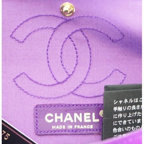 1137 - A Chanel medium-sized 2-55 bag in purple silk satin stitched with a quilted crocodile pattern, embel... 