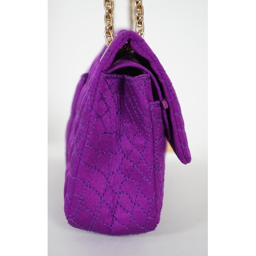 1137 - A Chanel medium-sized 2-55 bag in purple silk satin stitched with a quilted crocodile pattern, embel... 