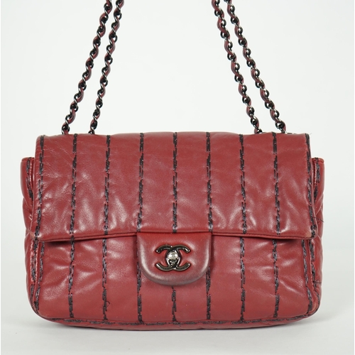 1140 - ** ** A Chanel Classic Jumbo Flap burgundy lambskin quilted shoulder bag, with pinstripe stitching, ... 