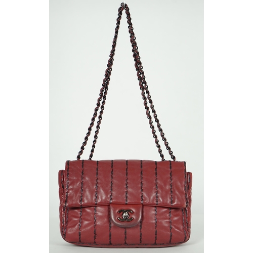 1140 - ** ** A Chanel Classic Jumbo Flap burgundy lambskin quilted shoulder bag, with pinstripe stitching, ... 