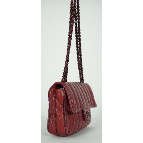 1140 - ** ** A Chanel Classic Jumbo Flap burgundy lambskin quilted shoulder bag, with pinstripe stitching, ... 