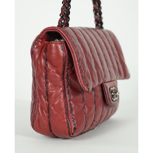 1140 - ** ** A Chanel Classic Jumbo Flap burgundy lambskin quilted shoulder bag, with pinstripe stitching, ... 