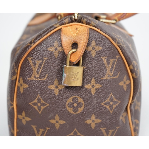 1142 - A vintage Louis Vuitton Monogram canvas Speedy 25 handbag, a Louis Vuitton Pochette Accessories Canv... 