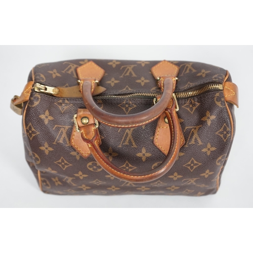 1142 - A vintage Louis Vuitton Monogram canvas Speedy 25 handbag, a Louis Vuitton Pochette Accessories Canv... 