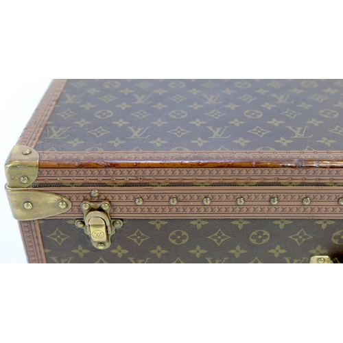 1145 - A Louis Vuitton monogram canvas and tan leather suitcase, with label for Paris and Nice number 19849... 