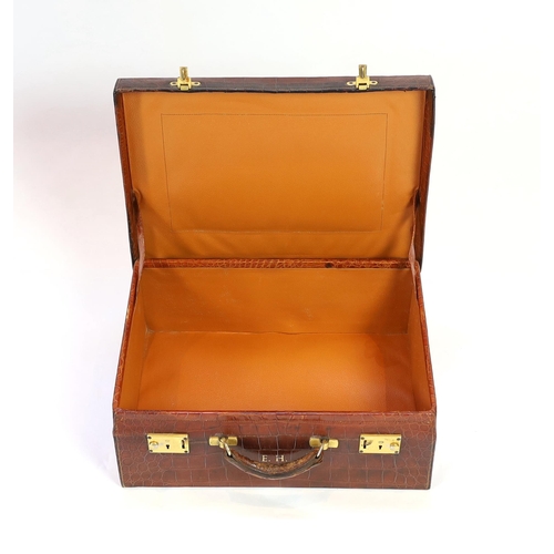 1146 - A 1920's crocodile skin suitcase, with gilt initials EH and locks stamped English Lever, width 50cm,... 