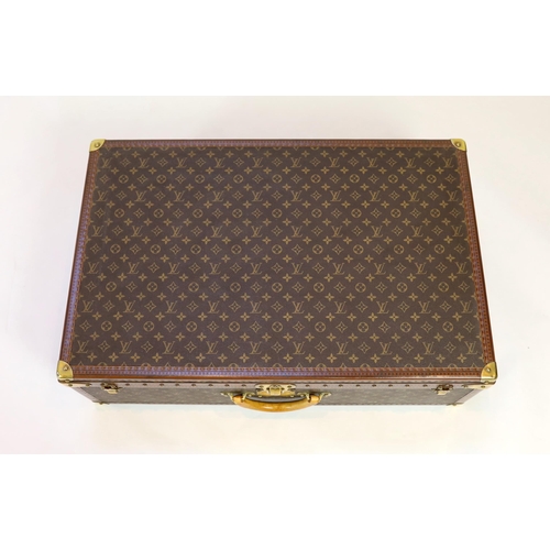 1147 - A Louis Vuitton monogrammed canvas and tan leather suitcase, with internal tray and Paris label numb... 