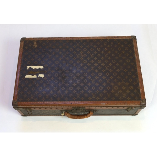 1148 - A vintage Louis Vuitton suitcase with monogram canvas and tan leather, initialled A.D, interior with... 