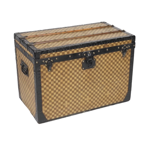 1149 - A Louis Vuitton Damier trunk, with black painted metal mounts and brass studded wooden slats over th... 