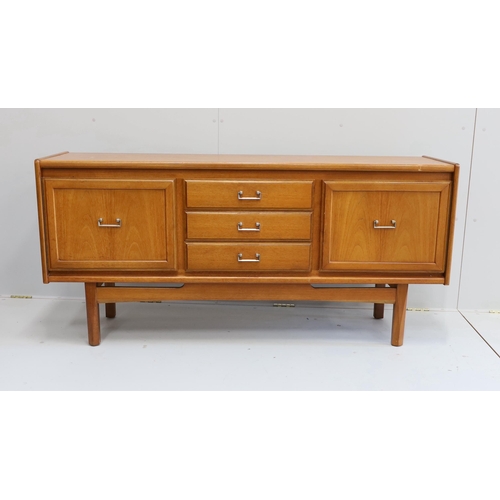 1163 - A mid century teak sideboard, bears William Lawrence label, width 163cm, depth 44cm, height 77cm... 