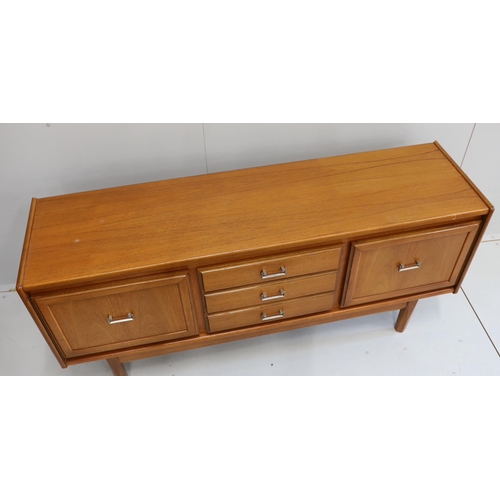 1163 - A mid century teak sideboard, bears William Lawrence label, width 163cm, depth 44cm, height 77cm... 