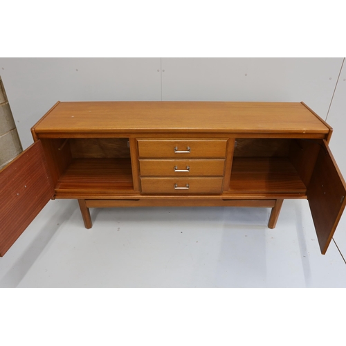 1163 - A mid century teak sideboard, bears William Lawrence label, width 163cm, depth 44cm, height 77cm... 