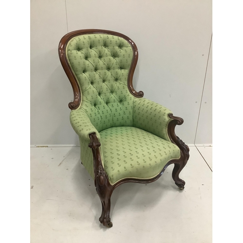 1167 - A Victorian carved mahogany button back armchair