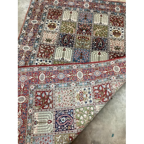 1181 - A Baktiari cream ground rug with divided field and triple border, 215 x 136cm