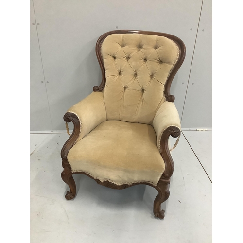 1187 - A Victorian carved mahogany button back armchair