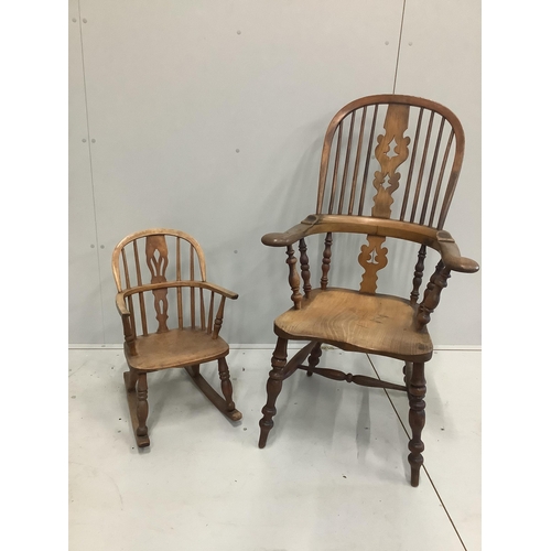 1188 - A 19th century turned comb back elm, ash and beech Windsor elbow chair with pierced splat, height 11... 