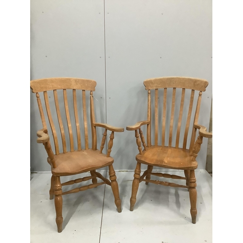 1194 - A pair of stained beech lathe back elbow chairs, height 112cm