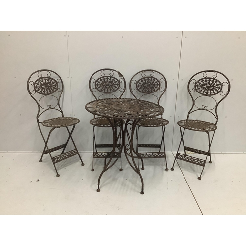 1210 - A cast iron garden table and four folding chairs