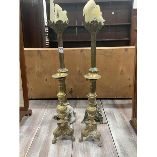 1213 - A pair of late 19th century brass altar sticks, height 70cm and a smaller pair of pricket candlestic... 