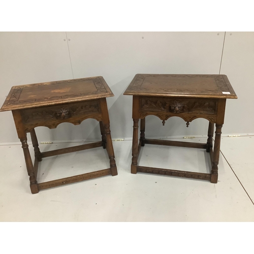 1223 - A pair of early 20th century carved oak bedside tables, width 66cm