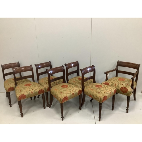 1232 - A set of seven Regency mahogany dining chairs with tablet cresting rails, upholstered seats on turne... 