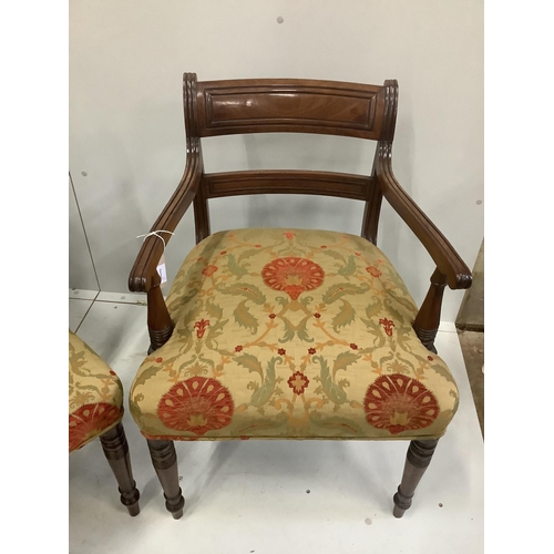 1232 - A set of seven Regency mahogany dining chairs with tablet cresting rails, upholstered seats on turne... 