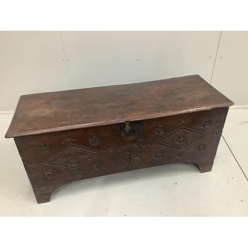 1233 - A 17th century style carved elm six plank coffer, width 112cm