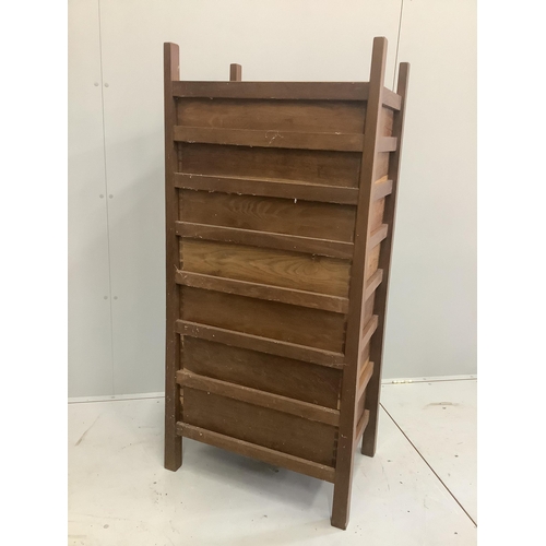 1238 - An Arts & Crafts oak seven drawer chest by Lawrence Tweedie of Derbyshire, width 67cm, height 142cm... 