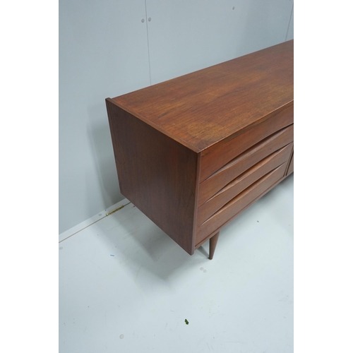 1277 - In the manner of Arne Vodder, a mid century teak sideboard width 221cm, depth 45cm, height 73cm.... 