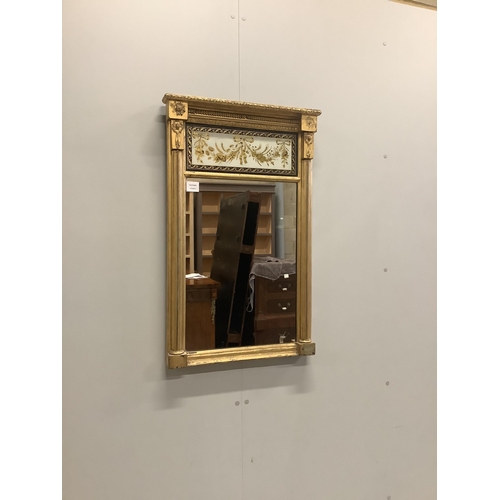 13 - A Regency giltwood and composition pier glass with eglomisé tablet, width 53cm, height 84cm