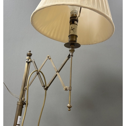 145 - A telescopic lamp standard, height including shade 142cm