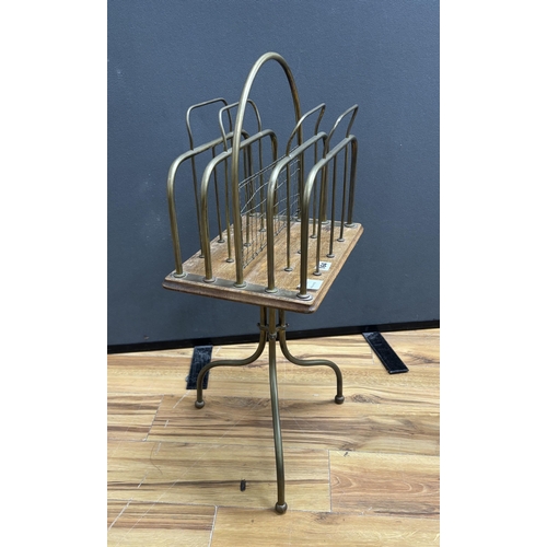 164 - An early 20th century oak and tubular brass four division newspaper stand, height 74cm