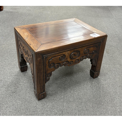 165 - A Chinese low rectangular hardwood stand carved with scrolls, width 37cm, depth 28cm, height 26cm... 