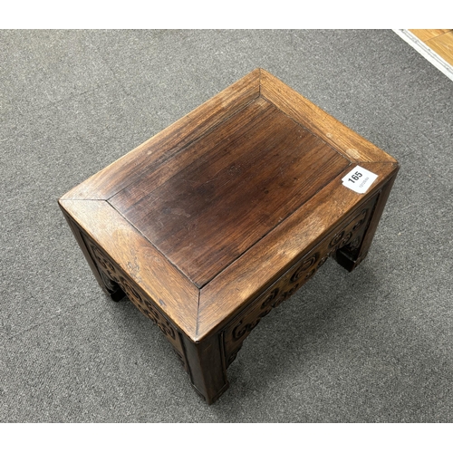 165 - A Chinese low rectangular hardwood stand carved with scrolls, width 37cm, depth 28cm, height 26cm... 