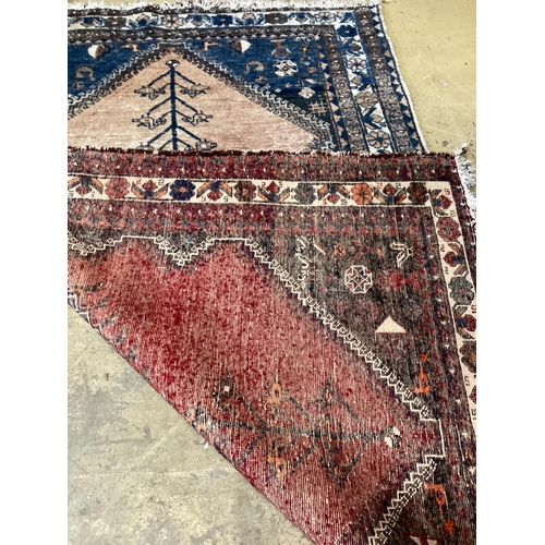 180 - A Caucasian red ground rug, 194 x 136cm