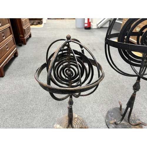 181 - Two wrought iron armillary spheres, largest 65cm