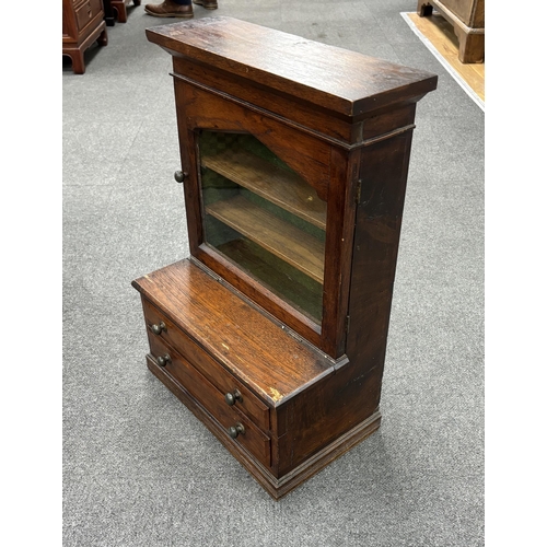 183 - A miniature glazed bookcase with drawers under, height 56cm