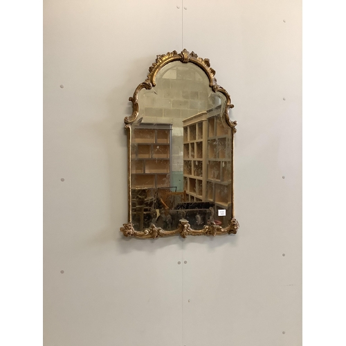 2 - An 18th century giltwood and composition bevelled wall mirror of arched form, width 62cm, height 97c... 