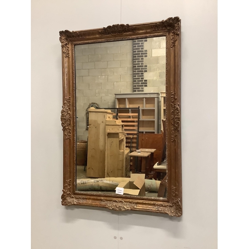 21 - A Victorian style giltwood and composition rectangular wall mirror, width 64cm, height 95cm