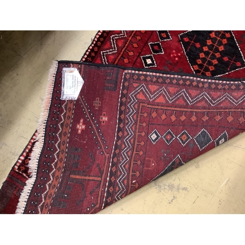 25 - A Turkish burgundy ground runner, 286 x 75cm