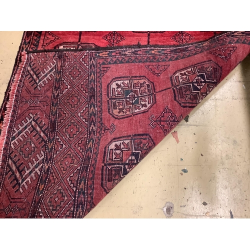 30 - A Bokhara red ground runner, 232 x 80cm