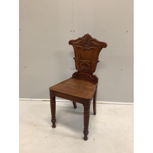 41 - An early Victorian carved oak hall chair, width 40cm, depth 37cm, height 86cm