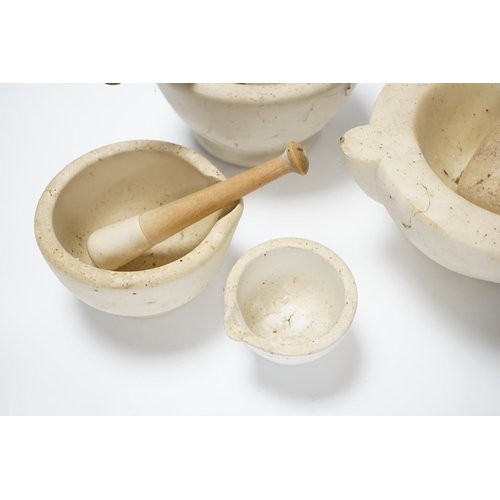 436 - Four mortars and three pestles, largest 23cm wide