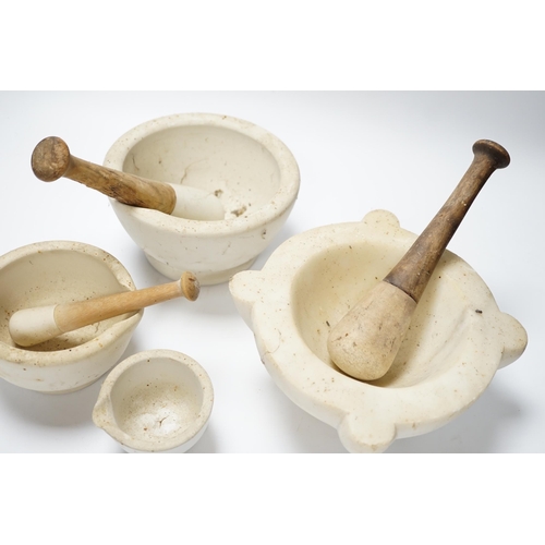 436 - Four mortars and three pestles, largest 23cm wide